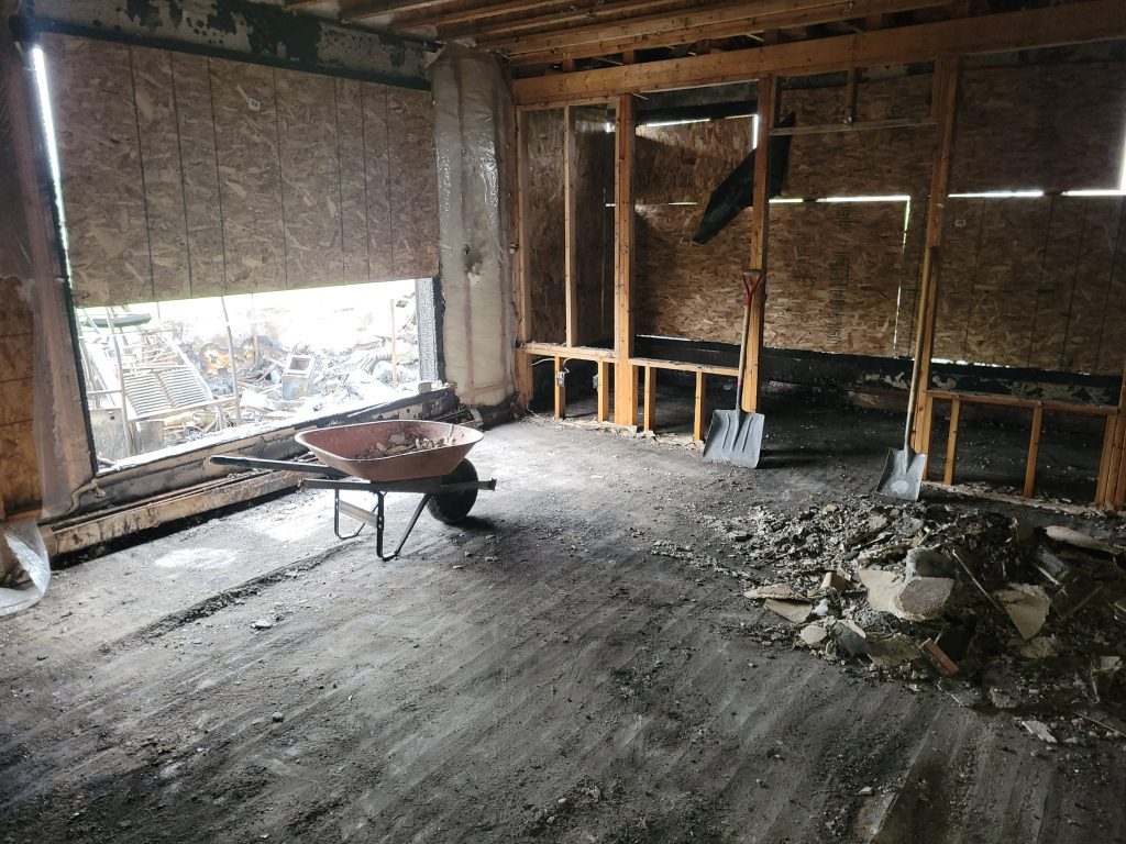 debris being cleaned in a home by stat restoration